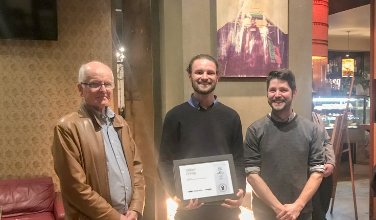 William Chrisp (middle) was awarded the scholarship at an NZILA event in Wellington. Bill Vincent (left) from Megabits made the presentation. NZILA Wellington Branch Chair Brennan Baxley is on the right.