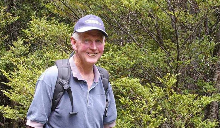 Lawrie Metcalf standing in front of a beech tree near Mt Arthur, Nelson. Photo: Melanie Kinsey.