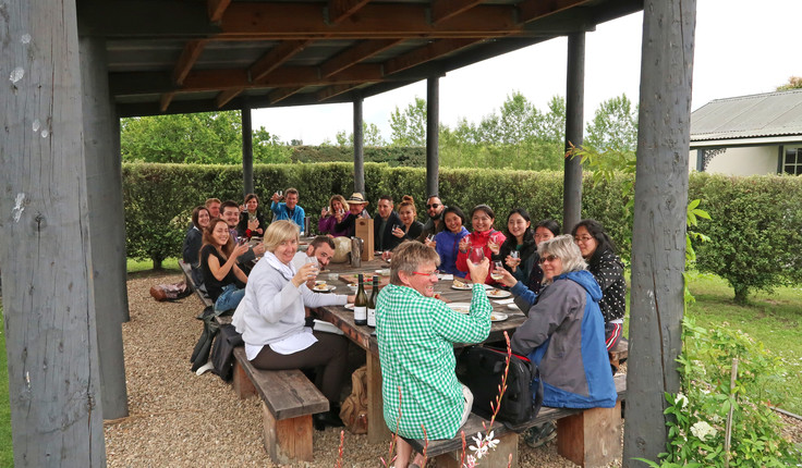 Branch members enjoying wine and food at Greystone Winery
