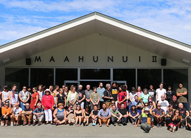 (Manuhiri ki Mahaanui II) – Attendees gathering under the mahau of Maahunui II at Tuahiwi Marae;