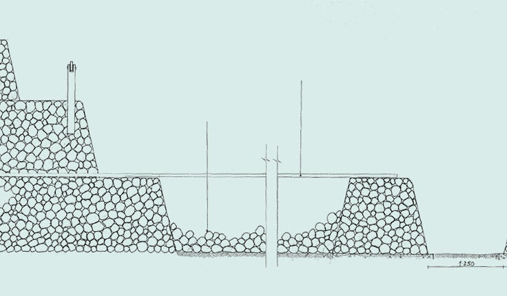 Maze created with boulders formed into walls and held in place with netting (a riverbed groyne-type construction)