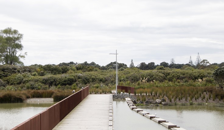 Long Bay, Auckland; the pedestrian bridge network integrates with weir infrastructure.  Credit Sam Gould