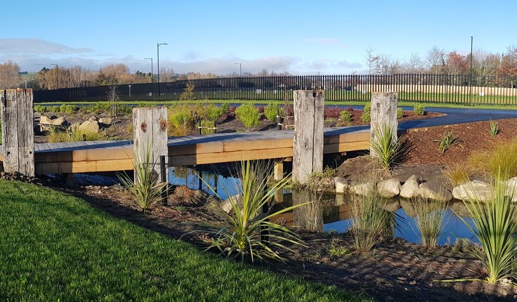 Timber bridges allow contact with the water, and good circulation for cyclists or joggers. The bridges are flanked by historic salvaged wharf beams, sourced from Lyttelton Port